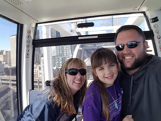 A girl and her family on The Great Wheel in Seattle