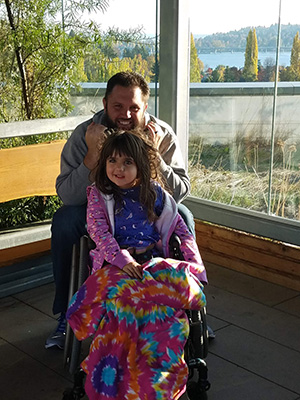 A girl and her dad on the rooftop garden at Seattle Children's Hospital