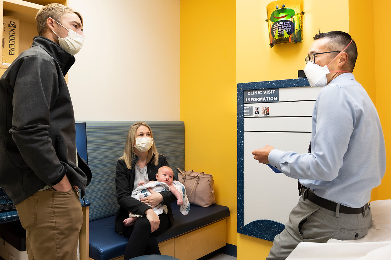 A Seattle Children's doctor talks with a patient and family