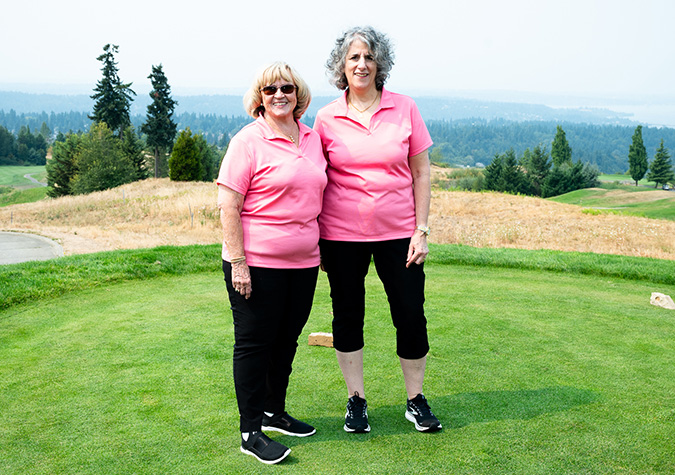 two women on a golf course