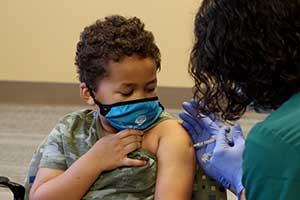 A boy receives a vaccination