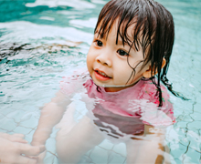 A toddler swimming in a pool