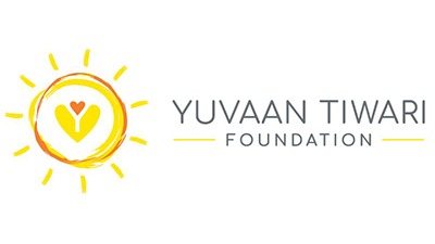 The logo for the Yuvaan Tiwari Foundation has a yellow sunshine outline, also outlined in orange, with a yellow heart in the center and a small orange heart above it. The words The Yuvaan Tiwari Foundation is to the right of the sunshine in grey text.
