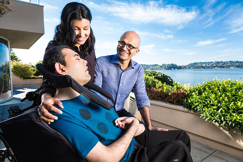 Nadella family on a patio overlooking the water