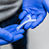 Hands holding tiny 3D-printed airway
