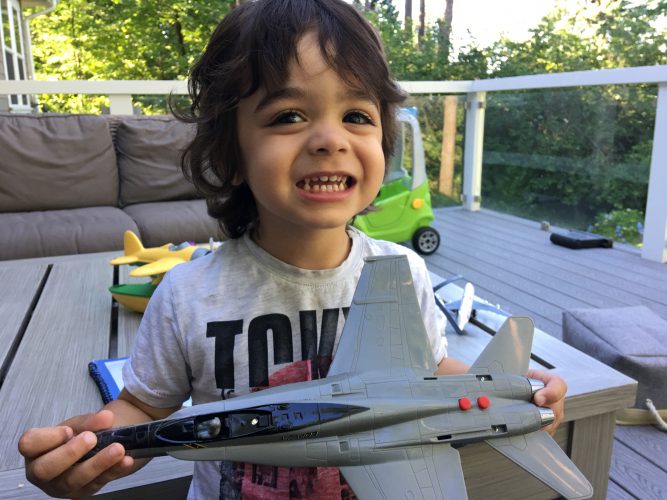 Yori Tsunodi smiles with his model airplane.