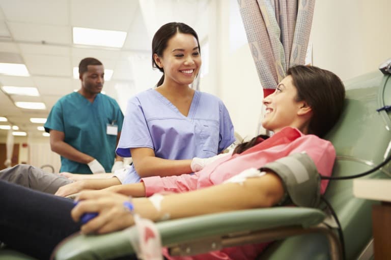 A woman donates blood