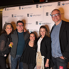 A group of people happily posing for a photo 