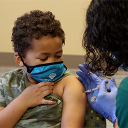 A boy receives a vaccination