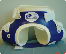 A blue and white brace made from rigid plastic