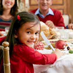 A family enjoys a holiday dinner together at the table