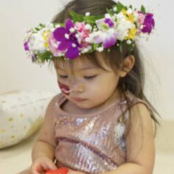 A baby in a flower crown