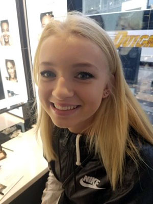 A teen girl poses for the camera