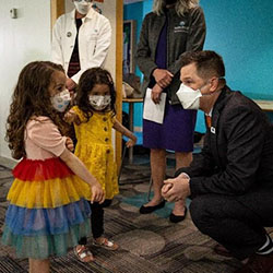 Dr Sperring talks to vaccine recipients at the Odessa Brown clinic.