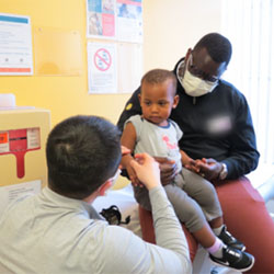 A boy is examined by a Seattle Children's doctor