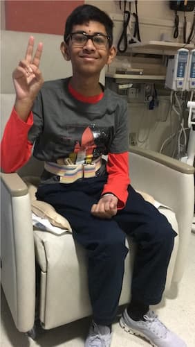 Sirish gives the peace sign.