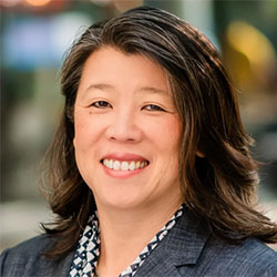 a close up woman smiling at the camera
