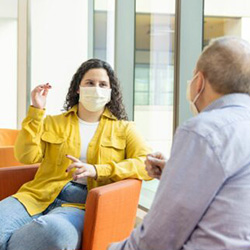 A teen patient speaks to a doctor