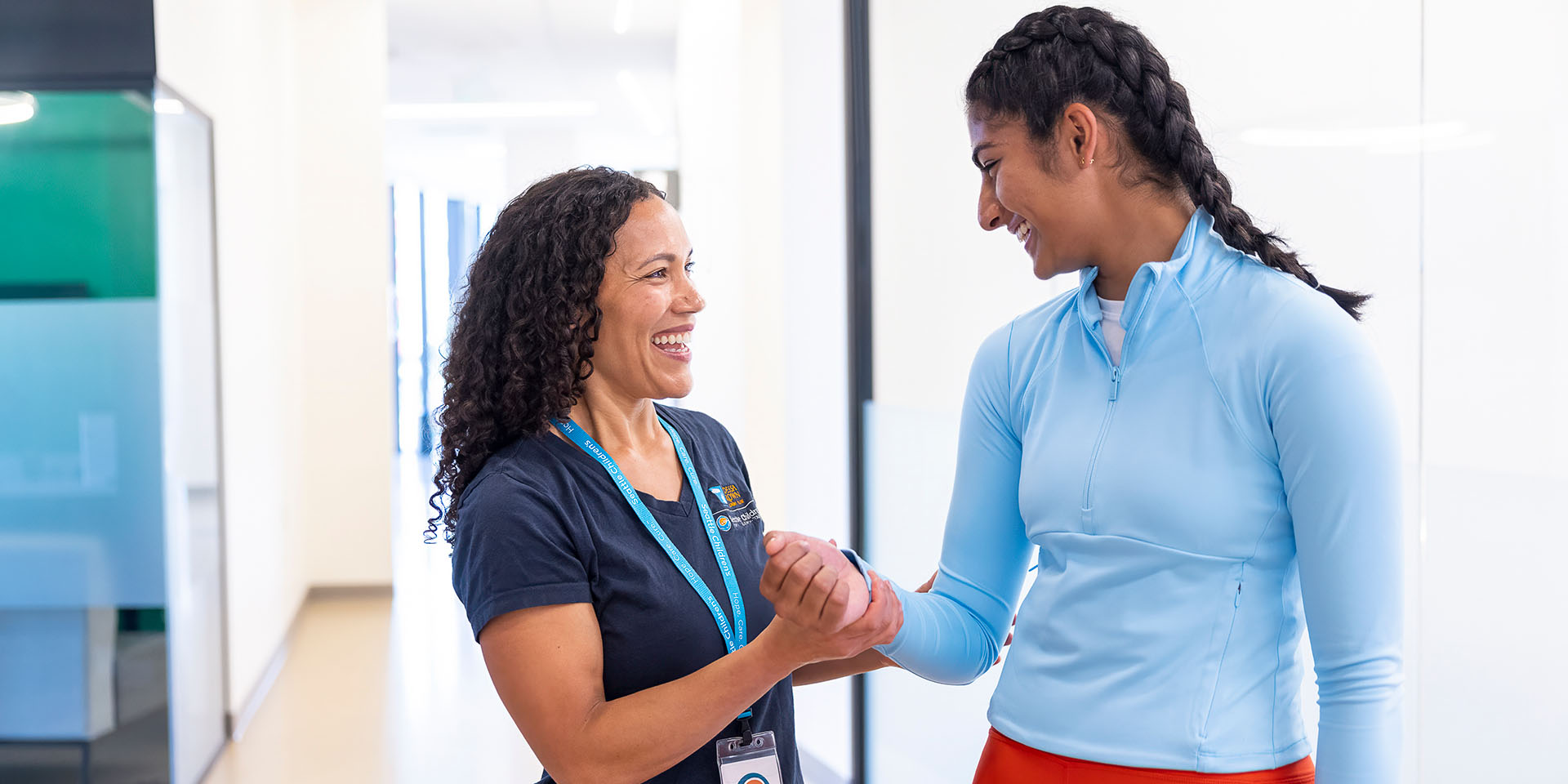 A Seattle Children's provider checks a patient's arm