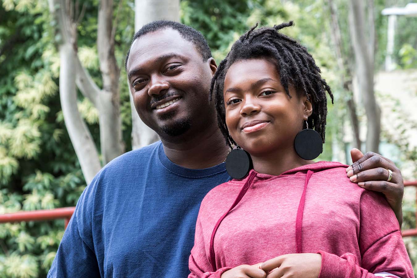 Daughter and Dad looking at the camera