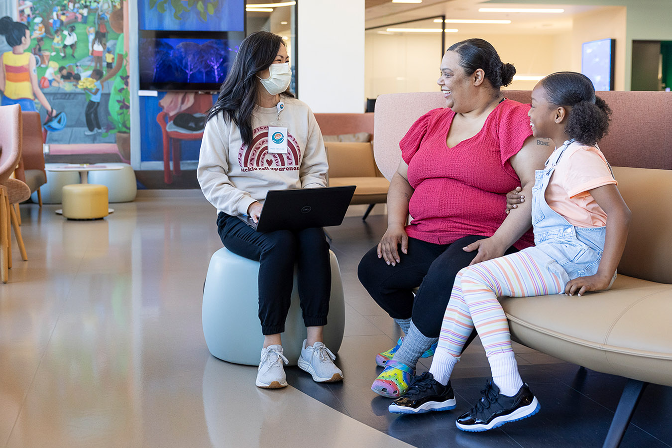 Mother and daughter talking to a provider