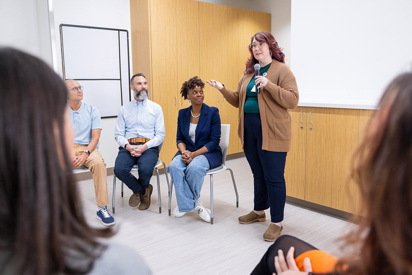A woman speaking in a group
