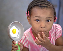Obesity Program - child with egg Obesity Program - child with egg