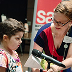 Sierra Nelson and Maria Moore A child prepares to read a poem