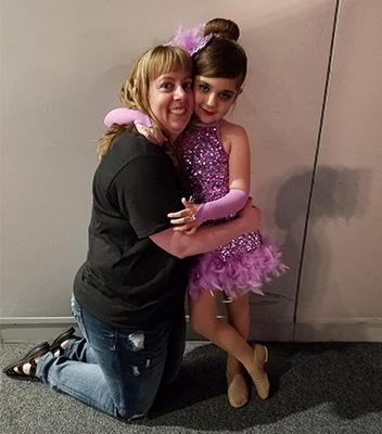 A girl and her mom after a dance recital