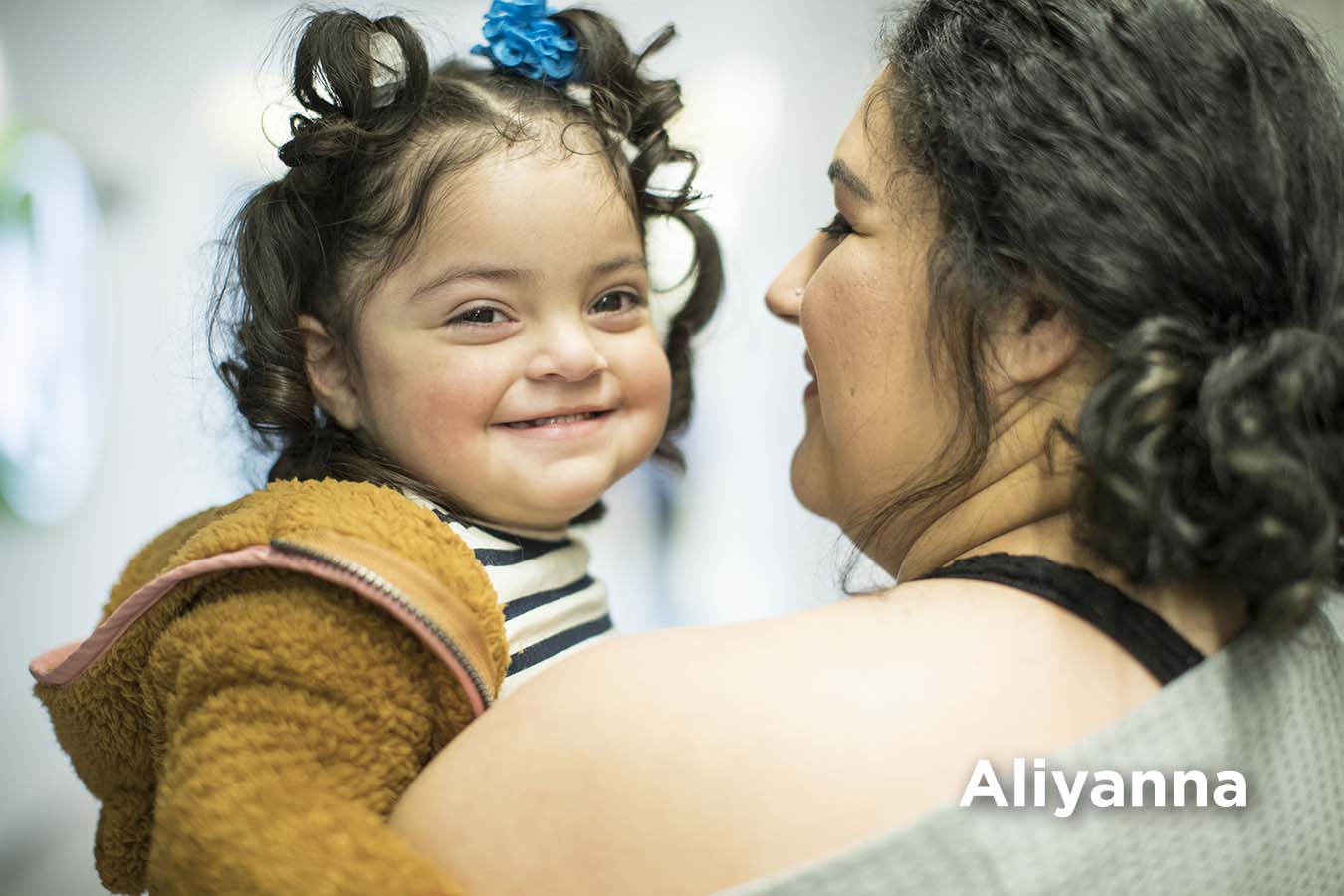 Aliyanna, a patient born with a fibrosarcoma tumor on her spine, and her mother