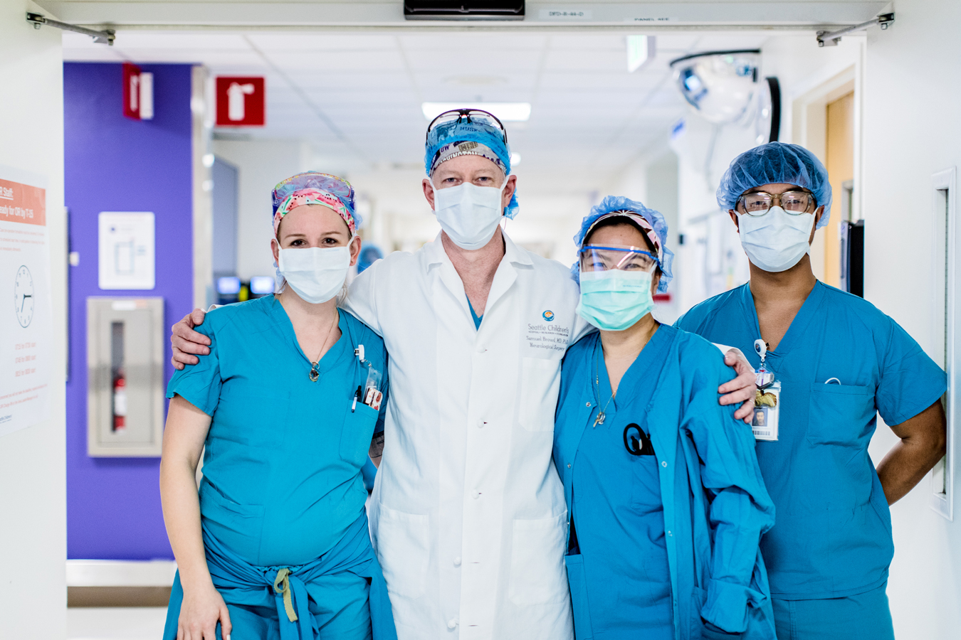Dr. Browd and team pose in masks and scrubs