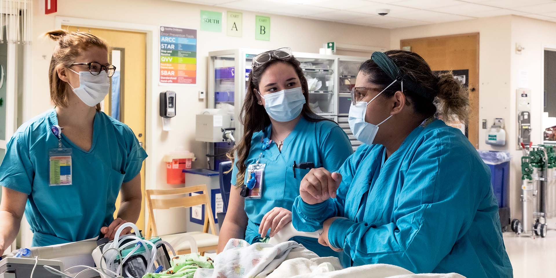 Seattle Children's nurses discuss a patient. At Seattle Children’s, our goal is to provide expert care for our patients and a healthy and safe work environment for our staff.