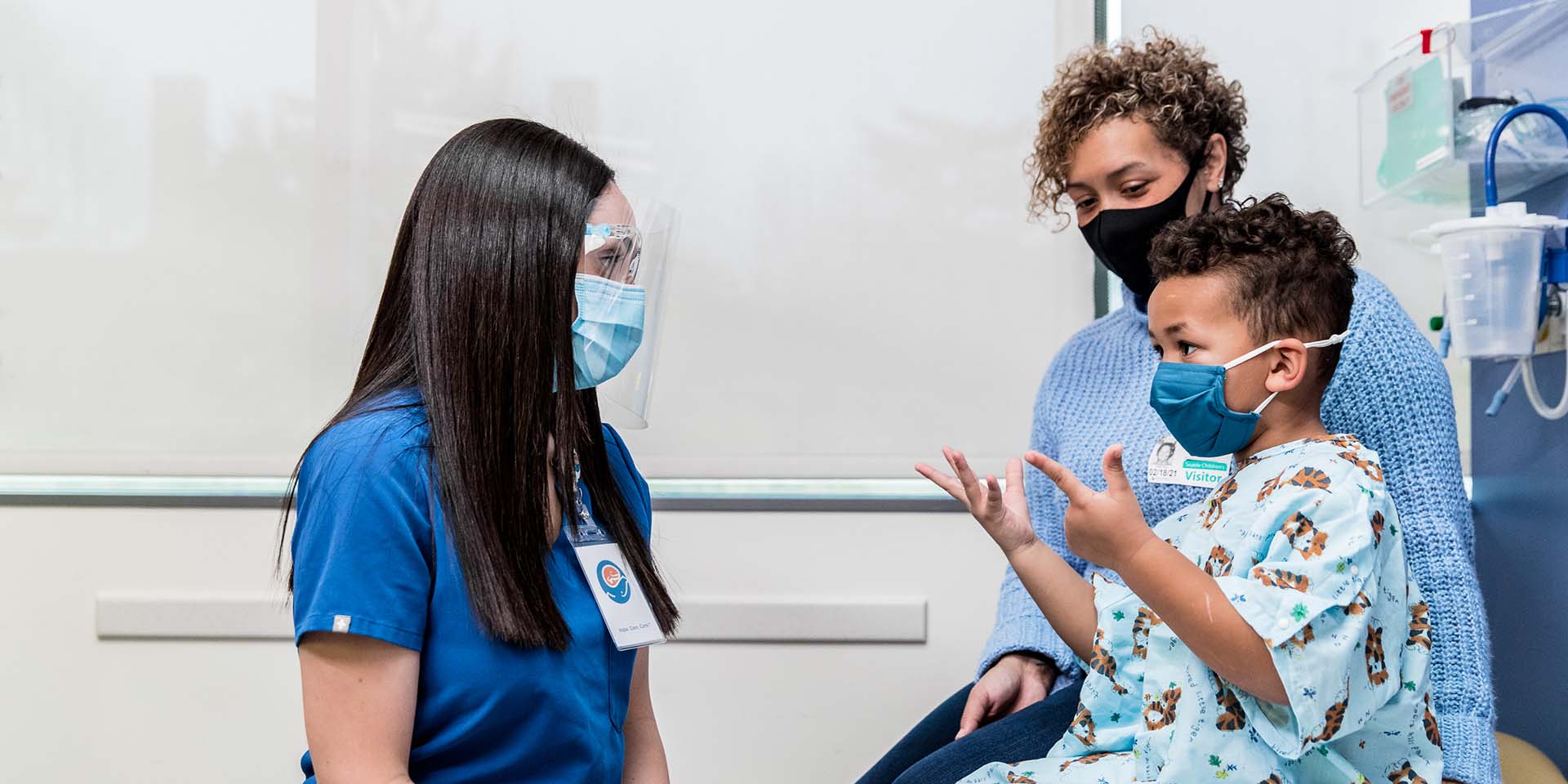 A nurse speaks with a mother and child. Seattle Children’s provides opportunities for our nurses to learn and grow in an innovative environment while being in full partnership with other providers on multidisciplinary teams.