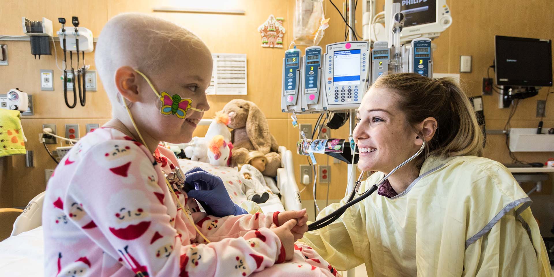 A nurse examines a girl. The Department of Nursing Practice, Professional Development and Innovation (NPPDI) is the initial contact point for all nursing, NP, PA and CRNA students who train at Seattle Children’s.