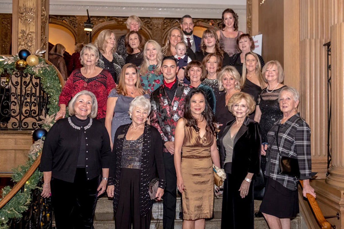 Members of the Festival of Trees guild pose for a picture.
