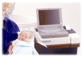 Brainstem Auditory Evoked Response (BAER) test being performed on newborn