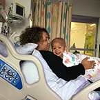 A mother and child in a hospital bed