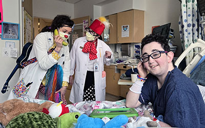 A Laughter League medical clown tries calling a patient using a "bananaphone."