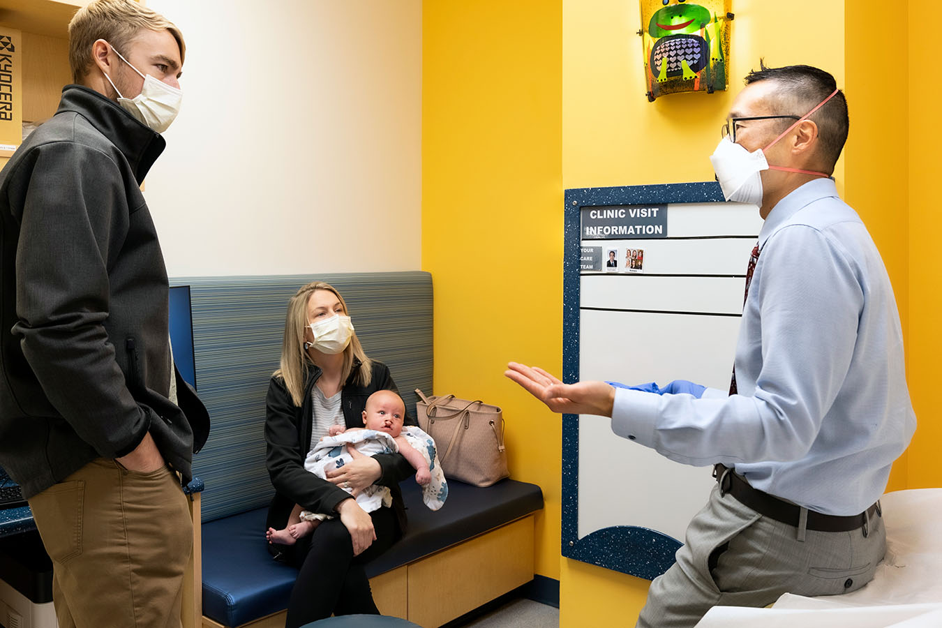 A Seattle Children’s doctor talks with a patient and family