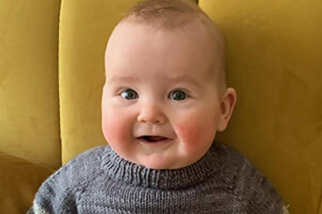 A baby looks at the camera