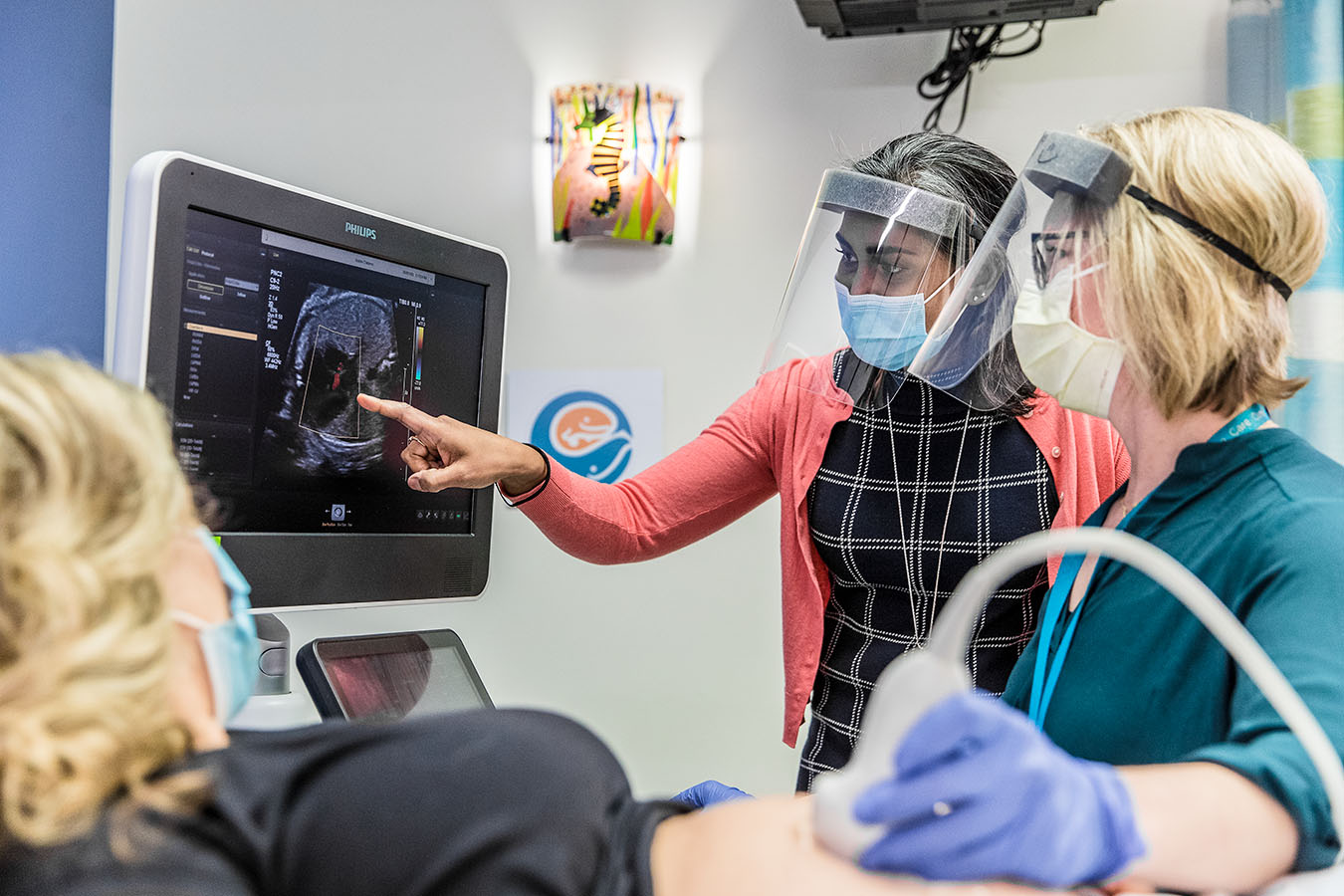 A Seattle Children's doctor reviews an ultrasound image