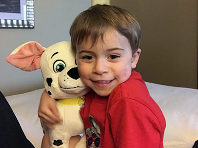 A boy with a stuffed animal