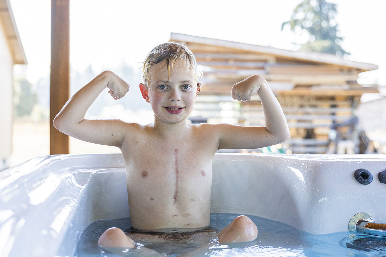A boy posing in his pool