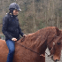 Carmen riding a horse