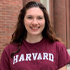 A teen in a Harvard T-shirt