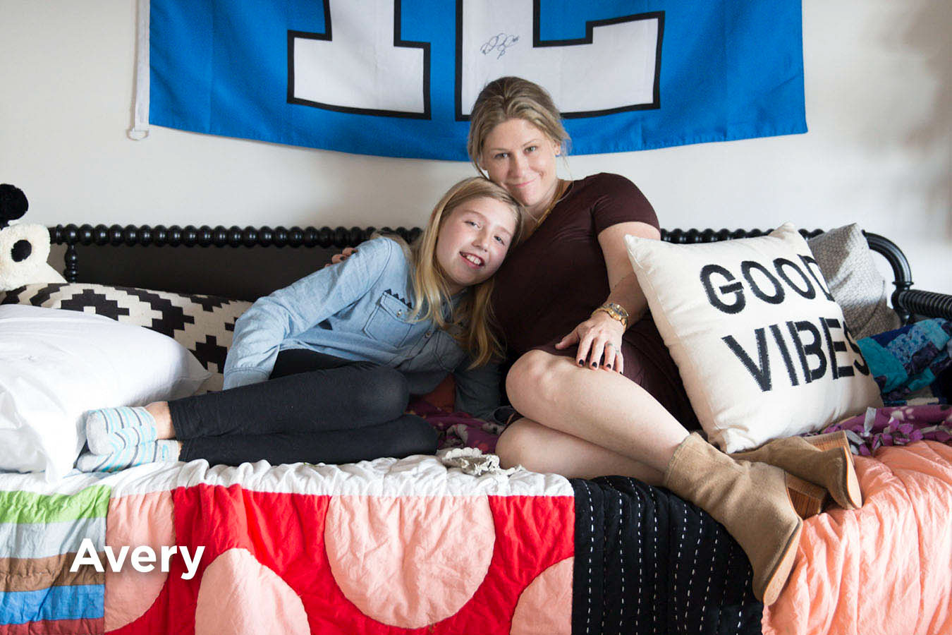 Seattle Children's Brain Tumor Program patient reclines on couch with mother