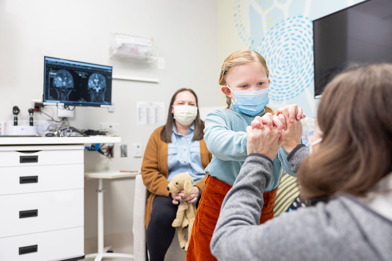 Seattle Children's Dr. Sarah Leary examines a brain tumor patient