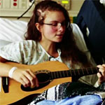 A teen girl with a guitar