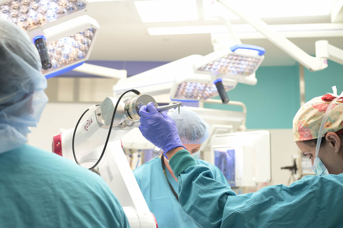 A team of pediatric neurosurgeons performing a procedure in the operating room.