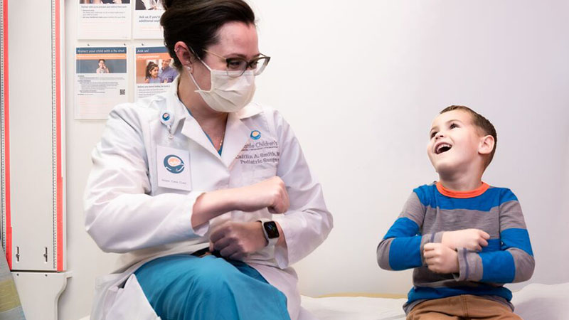 Seattle Children's Dr. Smith plays with a patient